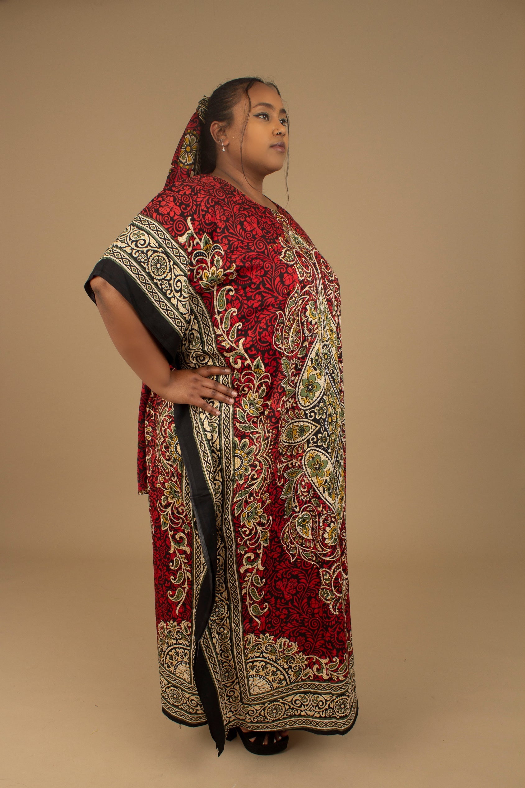 The Dashiki Floor Length Kaftan Dress in a lightweight Chiffon Fabric in a gorgeous rich red, white, black and gold floral mandala African Print pattern. Designed in England Made in Nigeria. 