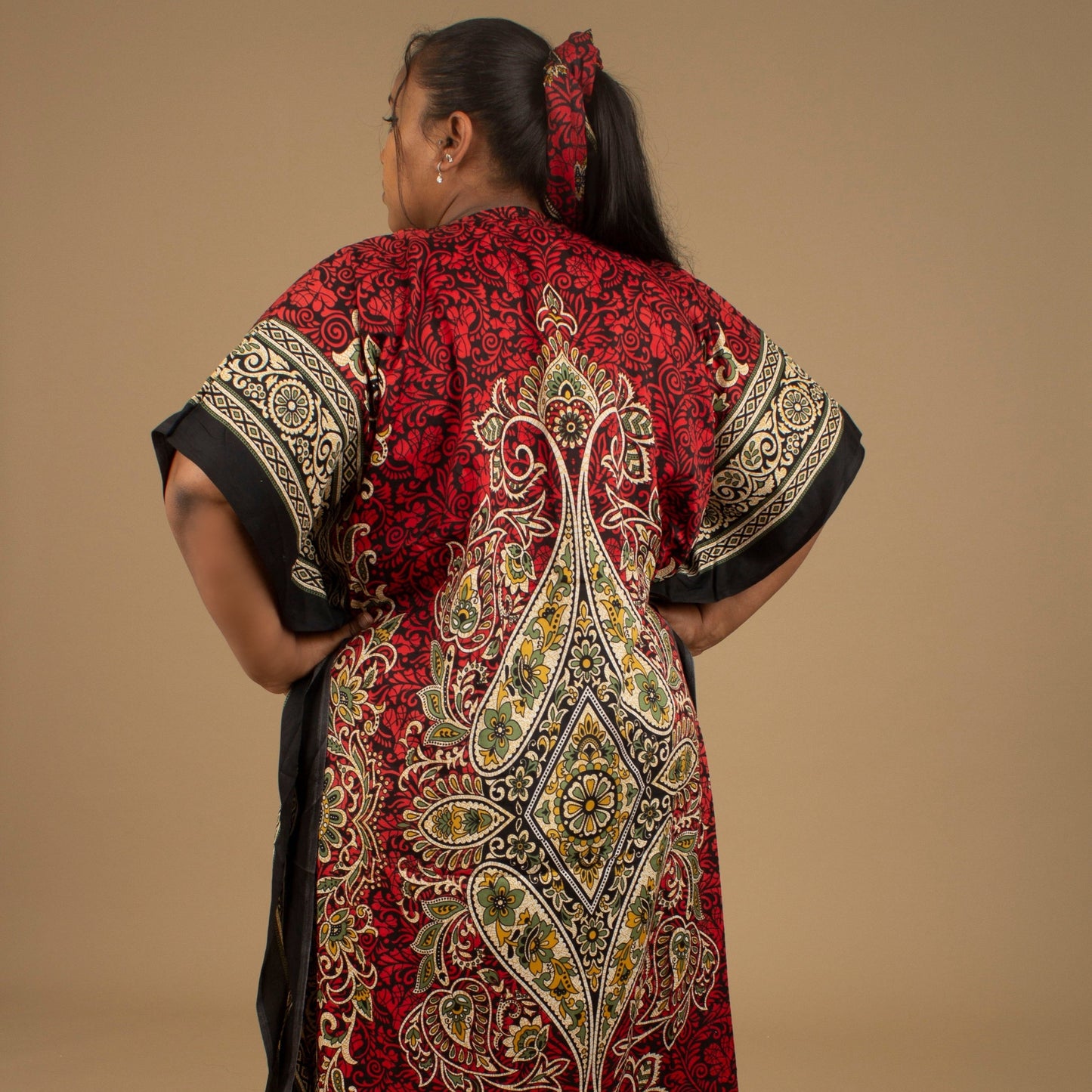 The Dashiki Floor Length Kaftan Dress in a lightweight Chiffon Fabric in a gorgeous rich red, white, black and gold floral mandala African Print pattern. Designed in England Made in Nigeria. 