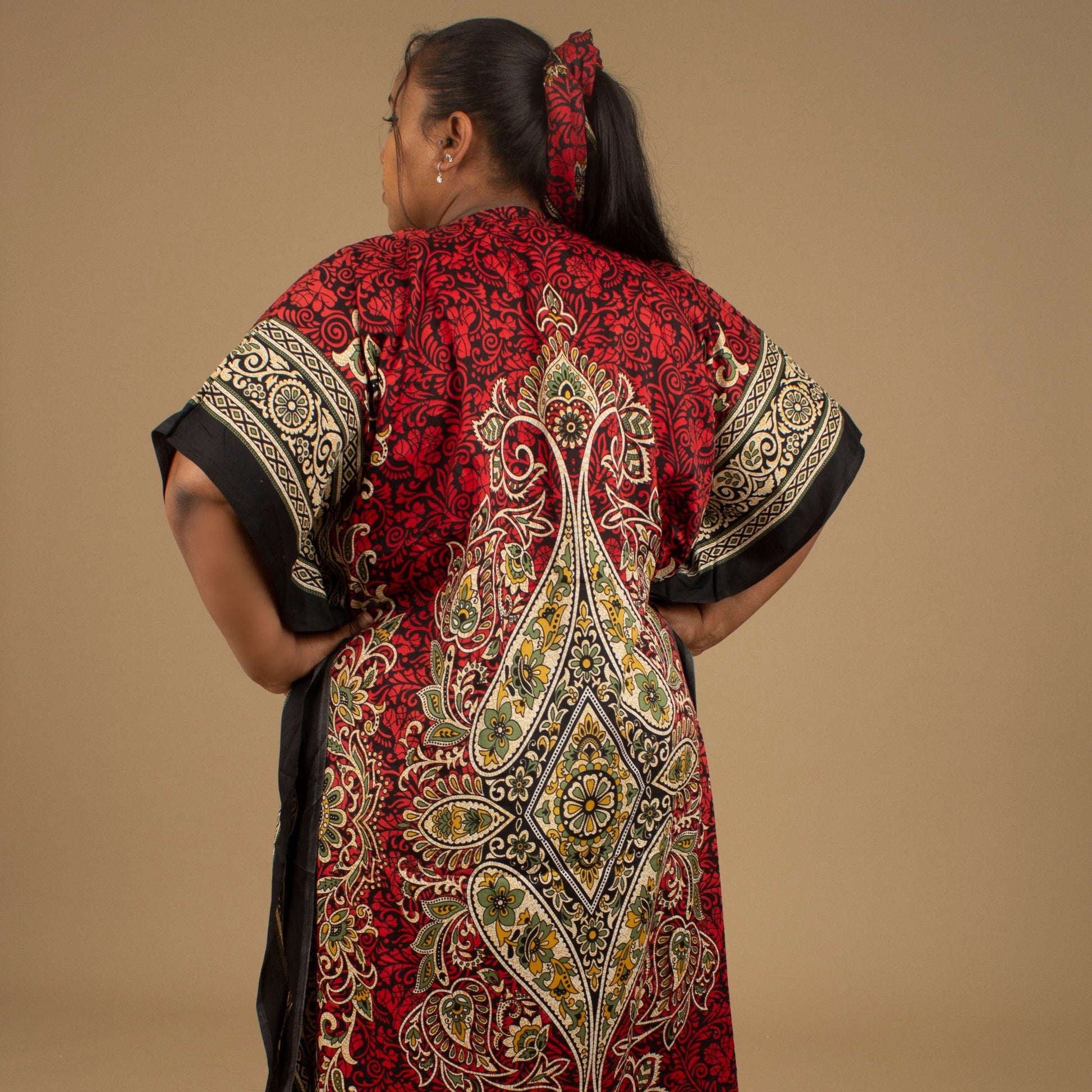 The Dashiki Floor Length Kaftan Dress in a lightweight Chiffon Fabric in a gorgeous rich red, white, black and gold floral mandala African Print pattern. Designed in England Made in Nigeria. 