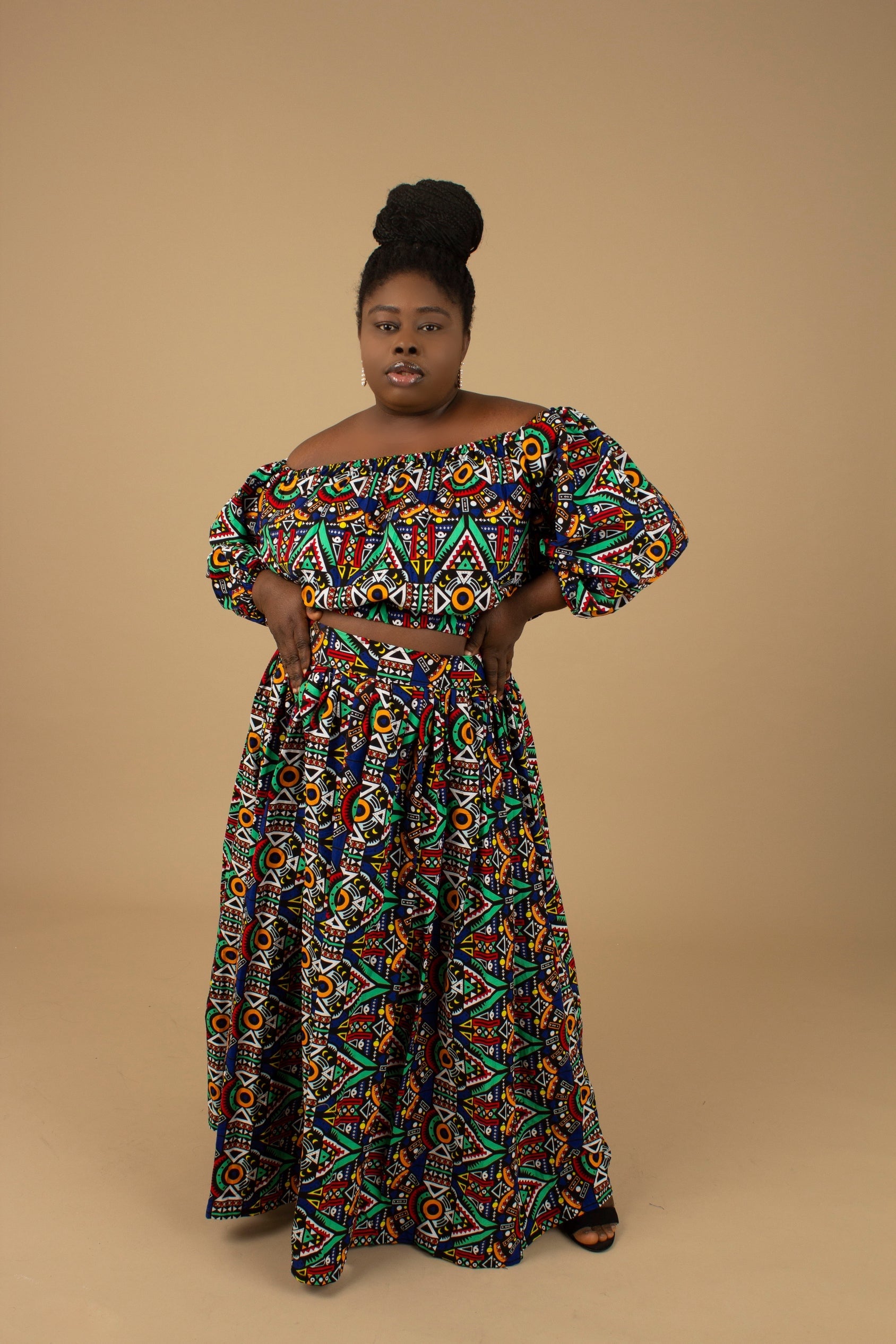 Ifemi Balloon Sleeved Crop Top with an elasticated neckline in a vibrant Ankara wax, geometric multicolored pattern using sustainable ethically sourced Cotton, designed in England Made in Nigeria.