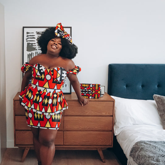 Red, pastel yellow, white and black African printKnee length pencil  skirt, in oversized geo-shaped pattern made from sustainably sourced Ankara wax print