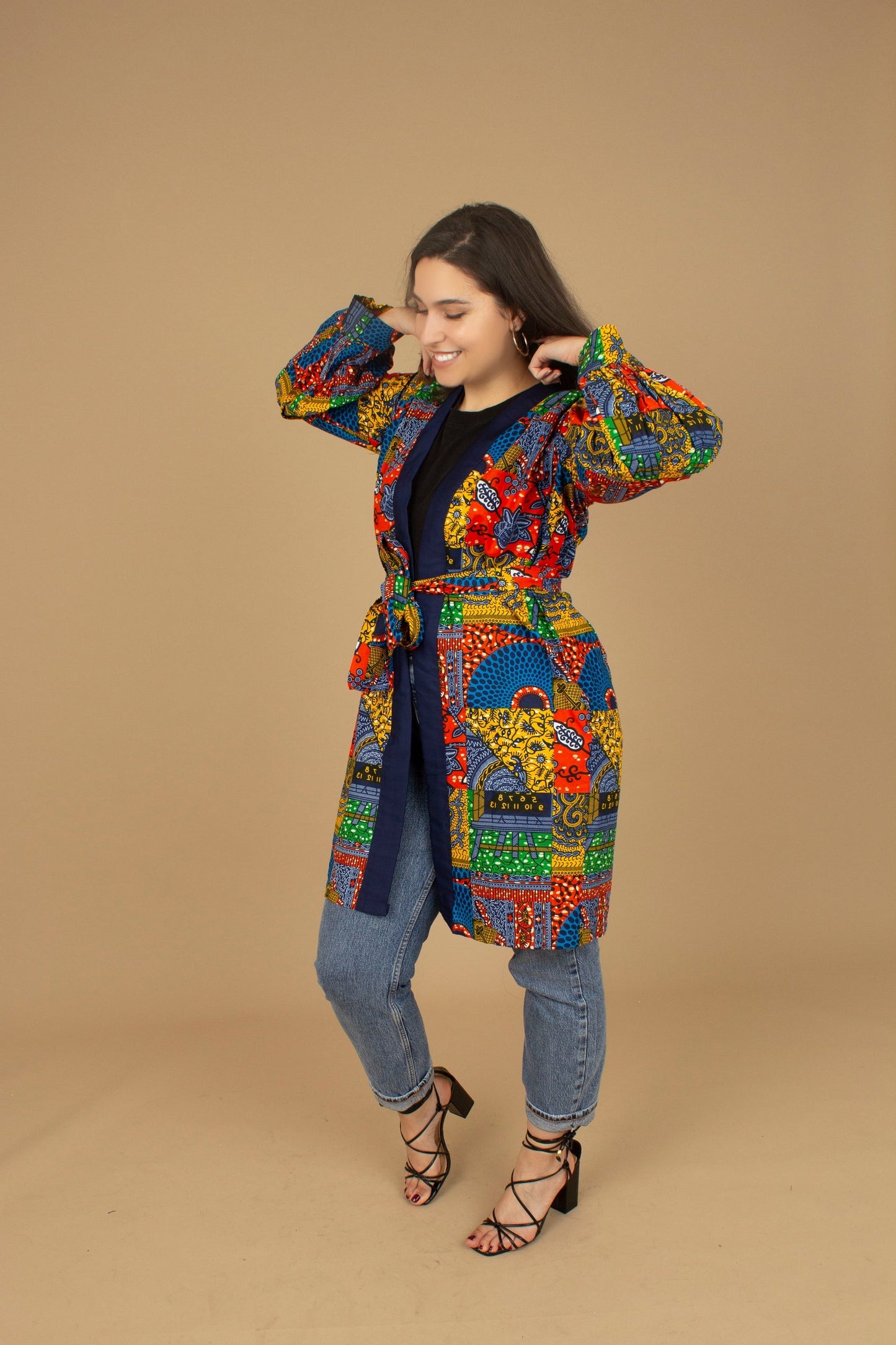 The Sade Patchwork Kimono Jacket is a vibrant multi-coloured mandala patchwork African wax Printed pattern jacket on sustainable cotton. Designed in England Made in Nigeria, Available in standard and plus sizes (UK 8-32). 