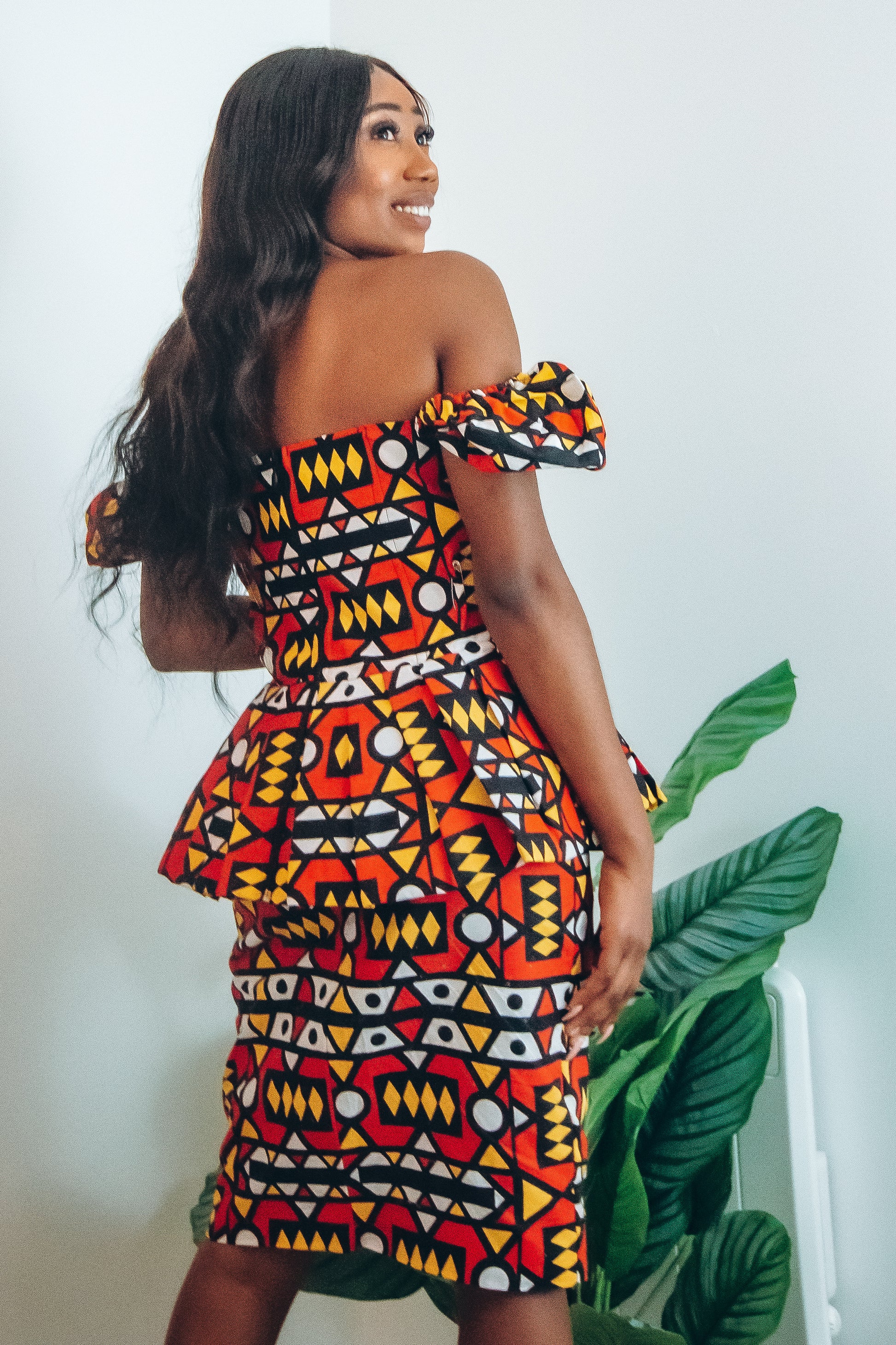 Red, pastel yellow, white and black African printKnee length pencil  skirt, in oversized geo-shaped pattern made from sustainably sourced Ankara wax print
